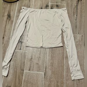 cream off the shoulder long sleeve top with arm and side seam cut outs